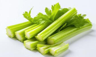 A bunch of celery stalks are cut in half photo