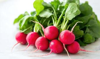 A bunch of radishes are sitting on a table photo
