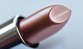 A close up of a lipstick with a shiny, metallic finish photo