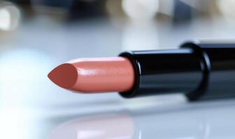 A lipstick is shown with a black cap photo
