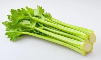 A bunch of celery with the green stalks showing photo