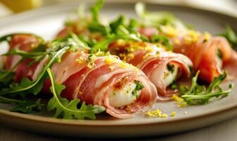 A plate of food with three pieces of bacon wrapped around a piece of cheese photo