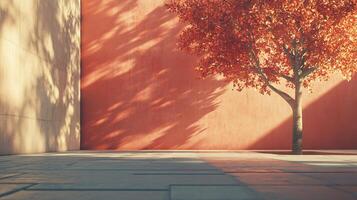 A tree is in front of a wall with a shadow on it photo