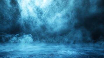 Ethereal scene of fog rolling across a dark surface, illuminated by a soft, blue glow creating a mysterious and atmospheric ambiance. photo