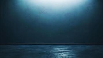 A dim bluish-gray room features a textured wall, a dark floor with a wet look, and soft lighting from above, creating a somber atmosphere. photo