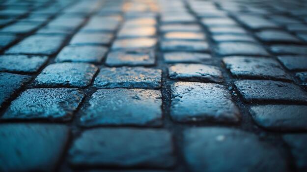 Close-up of a textured brick road with light reflections, creating a visually appealing street pavement view with a smooth depth of field. photo