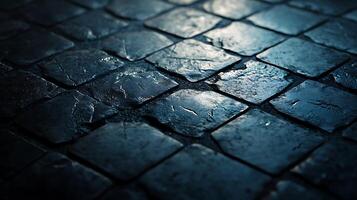 Close-up of wet cobblestone pavement, showcasing texture and pattern. Dark stone surface reflects light. Rough texture and street pattern. photo