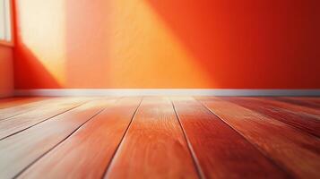 Cozy room with hardwood floor, blank orange wall, and natural light. Simple room aesthetic with a clean and polished look. photo