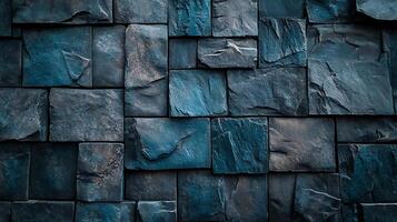 Blue-toned stone cladding wall shows a modern and rustic textured surface finish, achieved using natural stone cut into various square sizes. photo