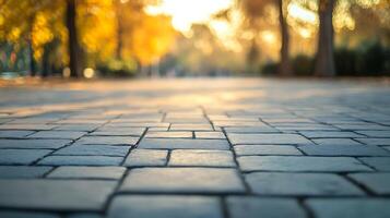 Cobblestone path bathed in the soft glow of morning sunlight, leading towards blurred trees in the background. Beautiful nature scene. photo