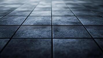Textured surface of dark ceramic tiles arranged in a grid pattern, creating a uniform and visually appealing flooring design. photo