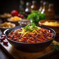 A hearty bowl of chili con carne, topped with shredded cheese and a sprinkle of fresh cilantro photo
