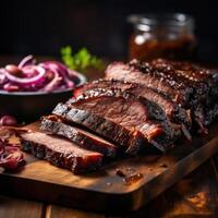 A close-up photograph of sliced beef brisket on a wooden cutting board, garnished with fresh herbs and served with a side of tangy barbecue sauce. photo