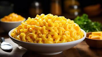 A large bowl of macaroni and cheese on a wooden table photo