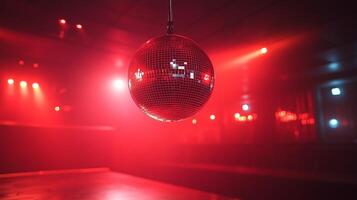 A disco ball hanging from a ceiling in a dark room photo