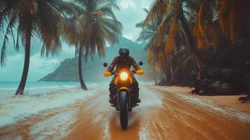 A person riding a motorcycle on a beach photo