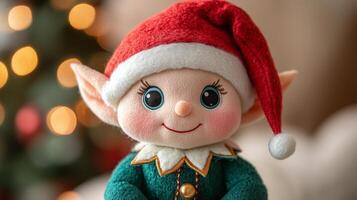 A small elf doll with a red hat and green shirt photo