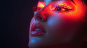 A woman with glowing eyes and red makeup photo