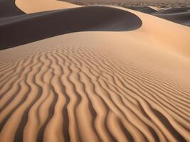 A detailed close-up of sand dunes, highlighting the wavy patterns, soft textures, and gentle shadows. photo