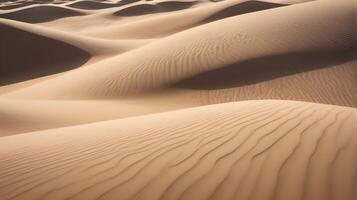 A macro shot of undulating sand dunes, capturing fine textures and the soft play of light and shadows. photo
