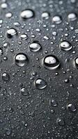 A zoomed-in view of water droplets forming spontaneous, unique patterns as they condense. photo