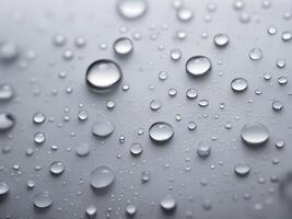 A detailed close-up of condensation droplets creating unpredictable patterns on a surface. photo