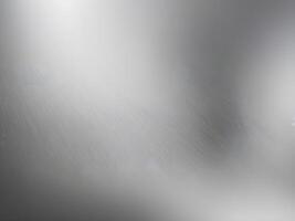 A high-resolution close-up of polished steel with subtle brushed patterns. photo