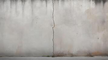 A close-up of a cracked concrete surface, emphasizing its rough and uneven texture. photo