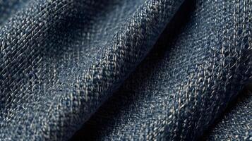 A sharp macro image of blue denim, emphasizing its visible interwoven fibers. photo