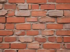 A sharp macro shot of red bricks with faded tones and deeply eroded mortar lines. photo