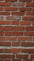 A close-up of a rustic brick wall with eroded mortar and a weathered, rugged look. photo