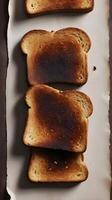 A macro shot of toasted bread, showing its crisp texture and slightly charred brown surface. photo