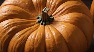 A high-resolution shot of a pumpkins surface, emphasizing its rough ridges and warm colors. photo