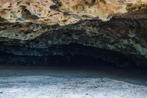 Entrance to a Coastal Cave with Textured Rock Ceiling in Hawaii photo