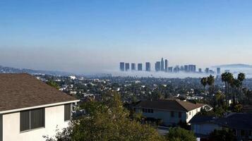 A city skyline with a foggy haze in the background photo