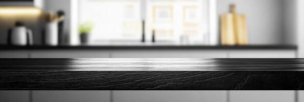 Modern kitchen interior with black wooden counter and blurred background photo