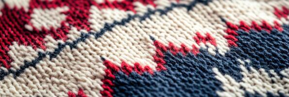 Close-up of knitted fabric with red, white, and blue pattern in a zigzag design photo