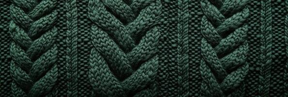 Close-up of green knitted wool fabric showcasing intricate patterns and textures photo