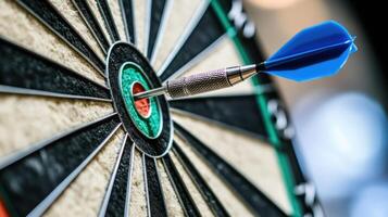 Close-up of a dart hitting the bullseye on a dartboard in a game concept photo