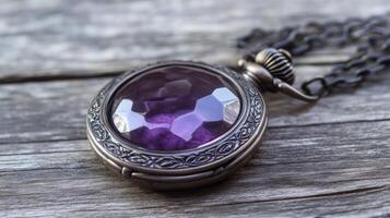 Vintage-inspired amethyst locket pendant resting delicately on textured reclaimed wood surface photo
