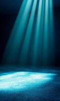 Ethereal illumination a radiant cyan glow descends onto a textured stage backdrop photo