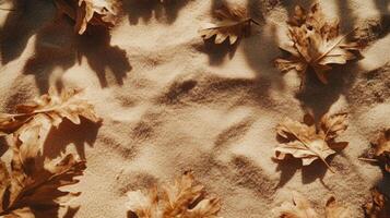 Golden autumn leaves gracefully scattered upon a serene backdrop of textured sand dunes photo