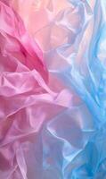 Ethereal fabric unfolds in pink and blue hues creating a soft and dreamy background design photo