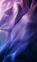 Elegant purple iridescent fabric ripples creating a mesmerizing translucent textile effect photo