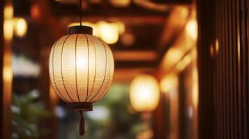Illuminated asian paper lantern casting a warm inviting glow in a traditional setting photo
