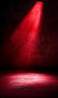 Crimson Spotlight Illuminates a Textured Stage, Casting Dramatic Shadows and Intense Color photo