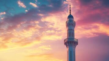 Minaret silhouette against painted clouds, serene architectural beauty in the sky. photo