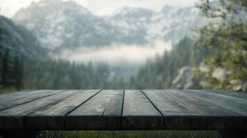 Rustic wood table surface with hazy mountain and forest scenery as a picturesque backdrop photo