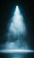 Ethereal illumination beam on enigmatic stage shrouded with vaporous fog spreading on surface photo
