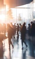 Blurry view of Business people silhouettes networking in modern office lobby during event photo